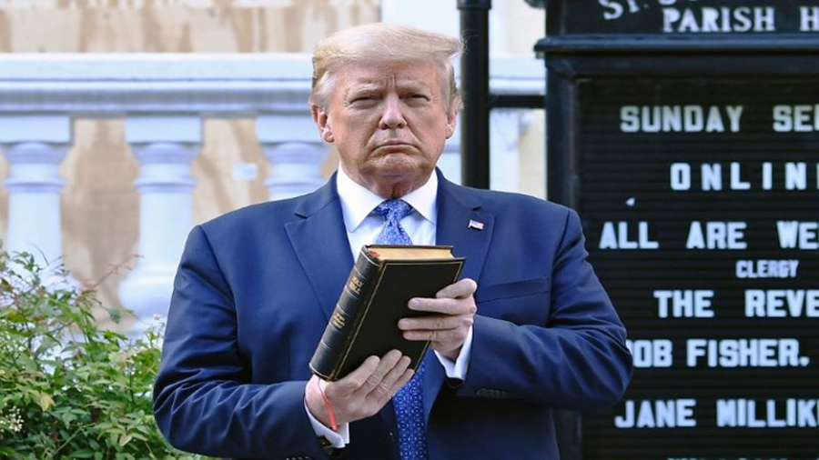 US President Donald Trump holds up a Bible outside of St John's Episcopal church across Lafayette Park in Washington, DC on June 1, 2020. AFP Photo